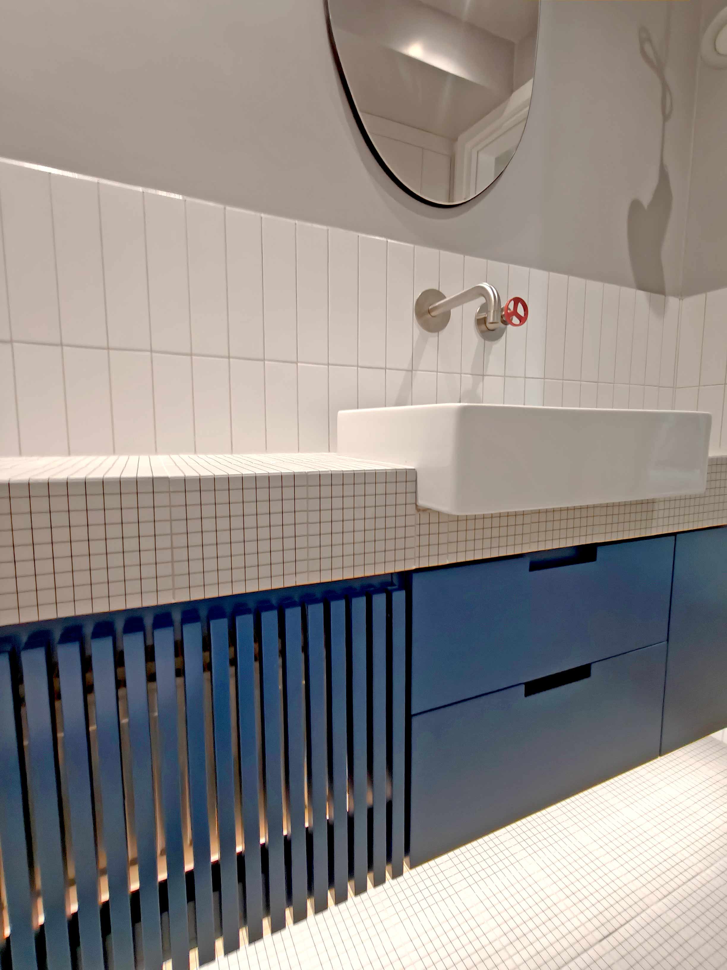 industrial minimal bathroom with blue furnitures